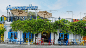 Santorini Vibes Cafe with white walls and blue domes overlooking West Lake, Tay Ho Hanoi