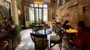Cosy interior of Loading T Cafe inside a French colonial villa near Train Street, Hanoi