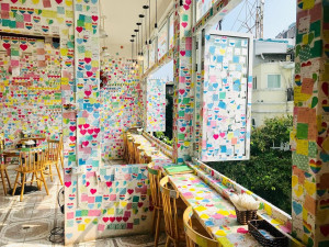 Colourful sticky notes covering the walls of The Note Coffee cafe in Hanoi Old Quarter